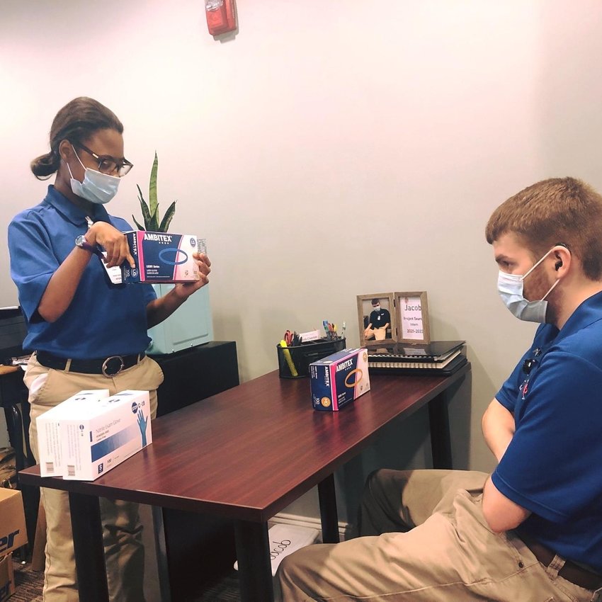 Project SEARCH interns and Neshoba Central High School students McKenzie Street and Jacob Clayton conduct a review of sanitation supplies at Neshoba General Hospital. Neshoba Central partnered with the hospital to implement Project SEARCH.